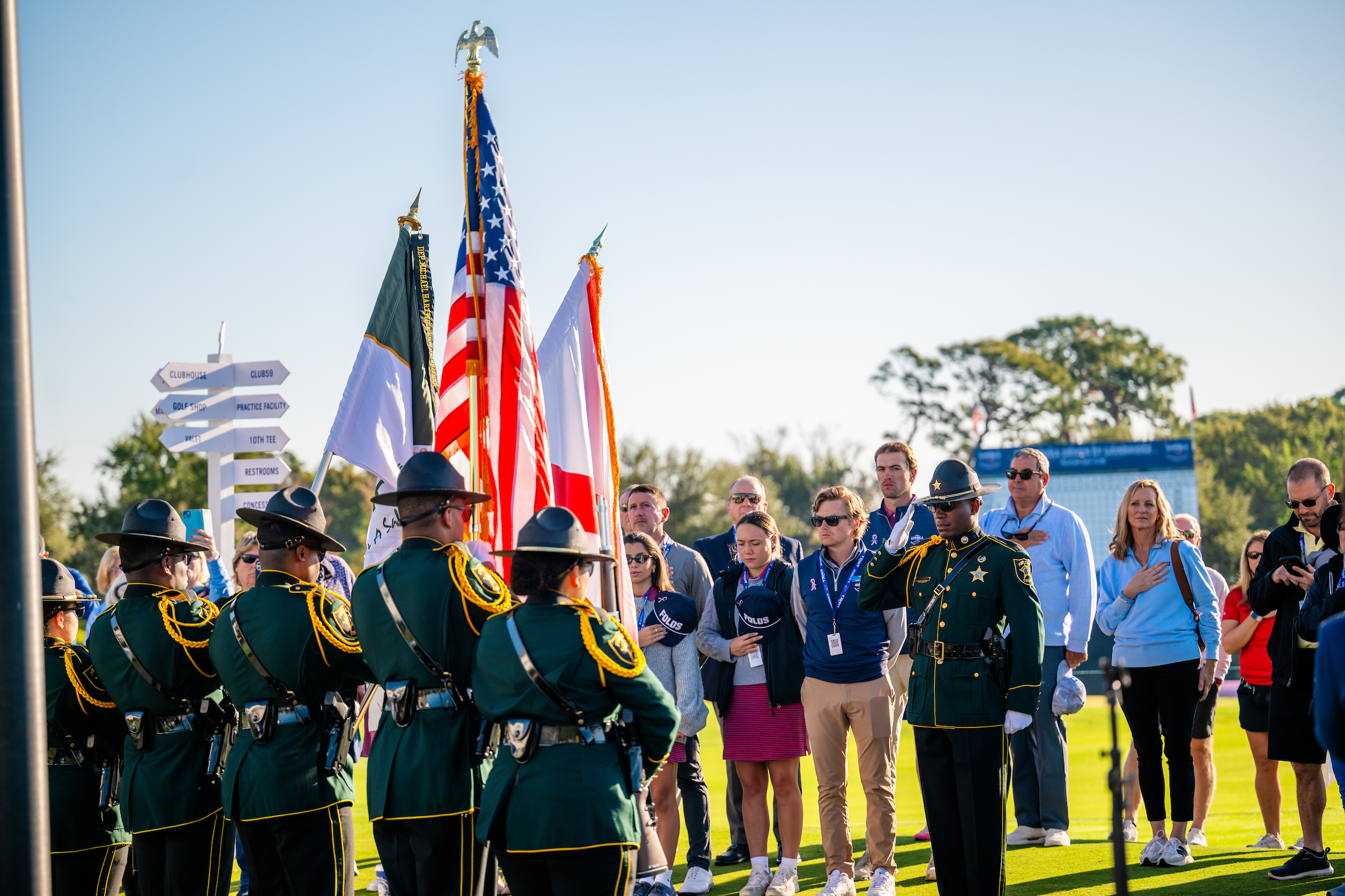 group of attendees holding American flags