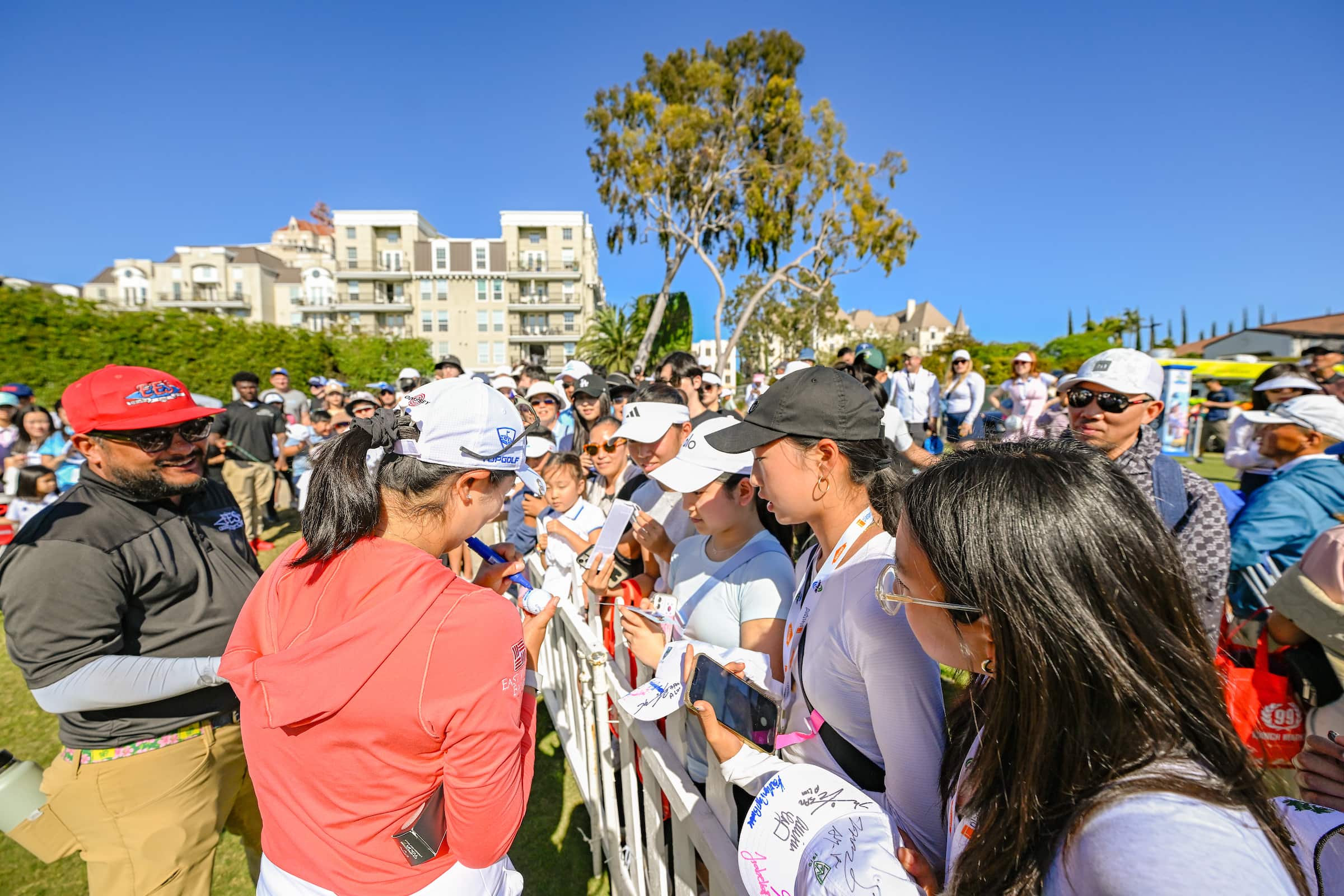 Golfer signing autographs
