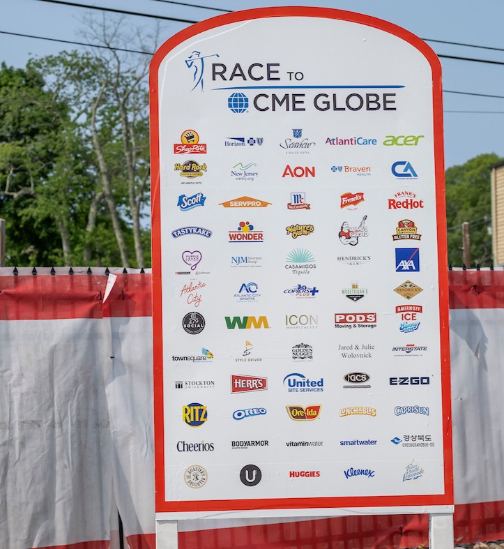 board with logos of corporate sponsors