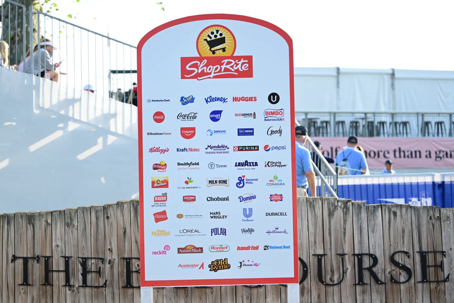 board with logos of corporate sponsors