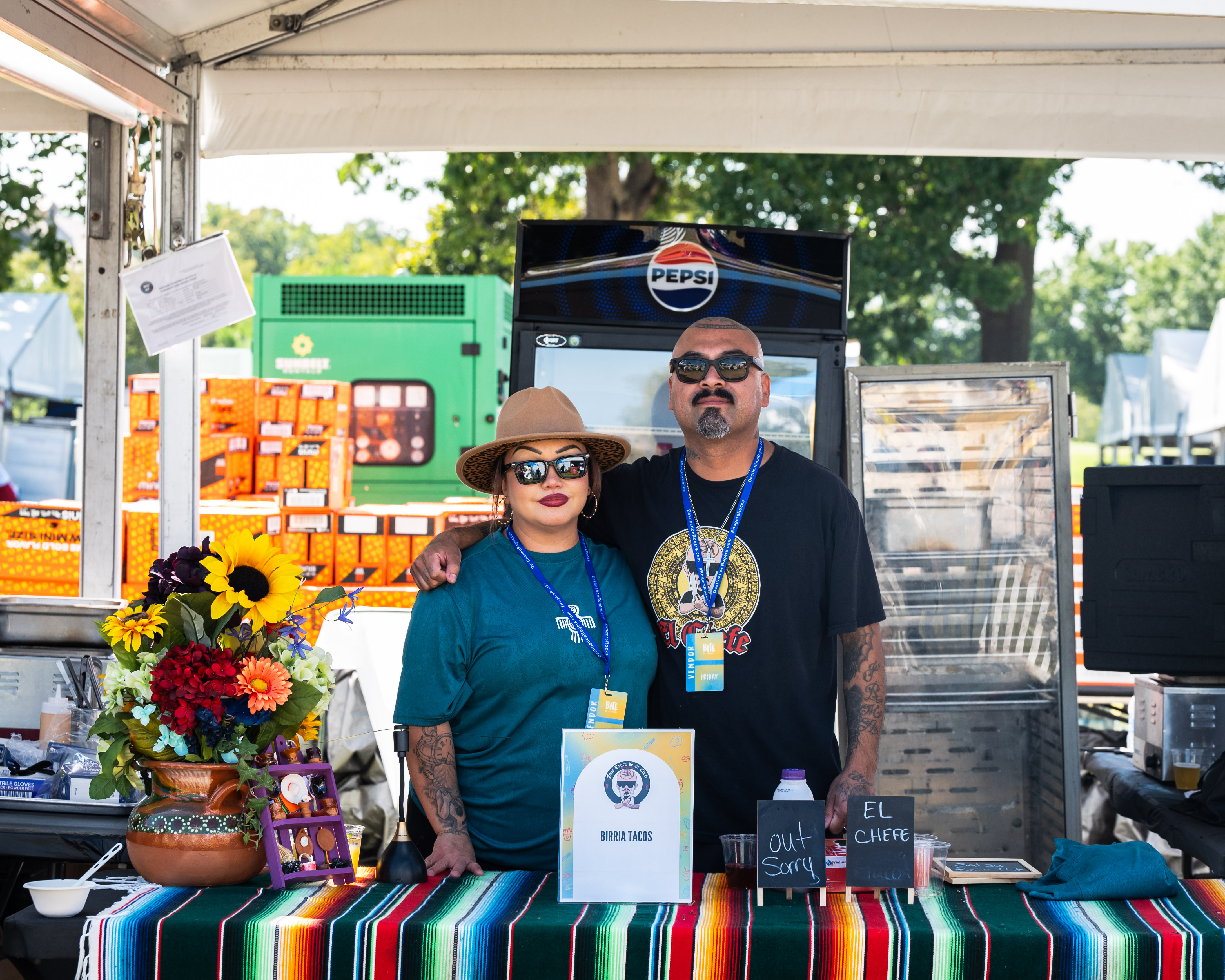 vendors standing in front of their stand