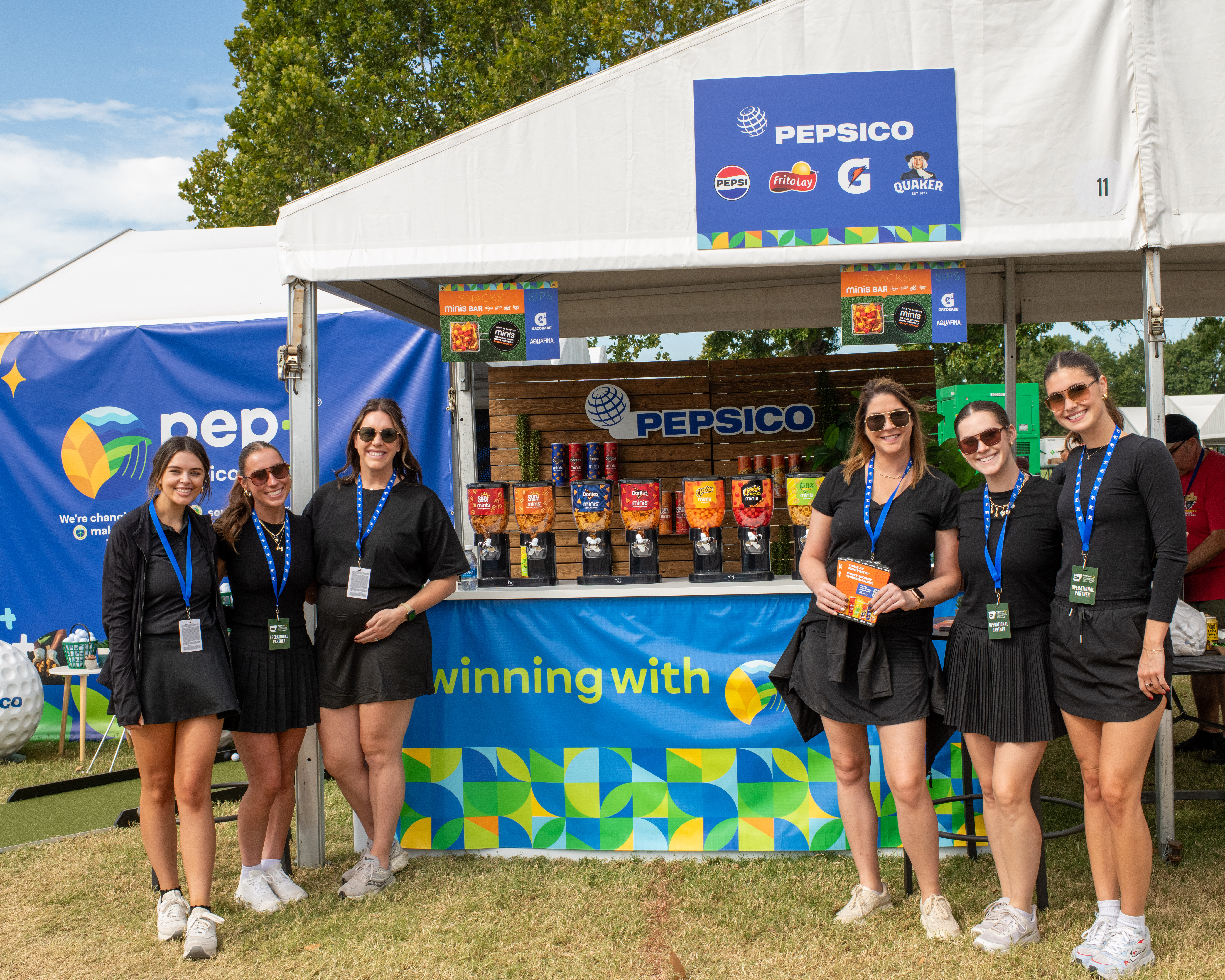 event sponsors standing with their products
